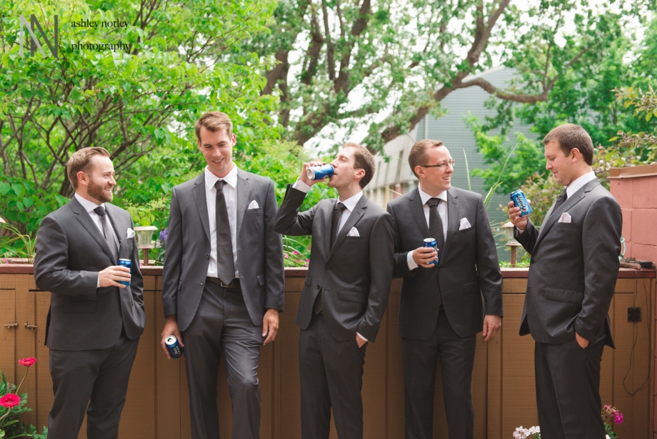 Groomsmen drinking beer on the porch