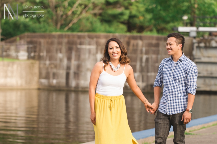 Couple by the locks during engagement photo session