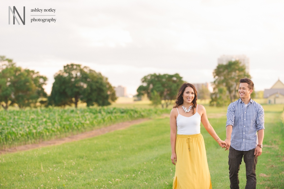 Couple walking together at the Experimental farm during their engagement photo session