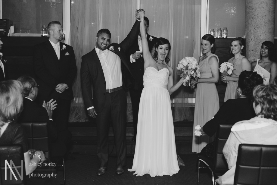 Bride and groom recessional after wedding ceremony at Sidedoor Contemporary Bar and Kitchen