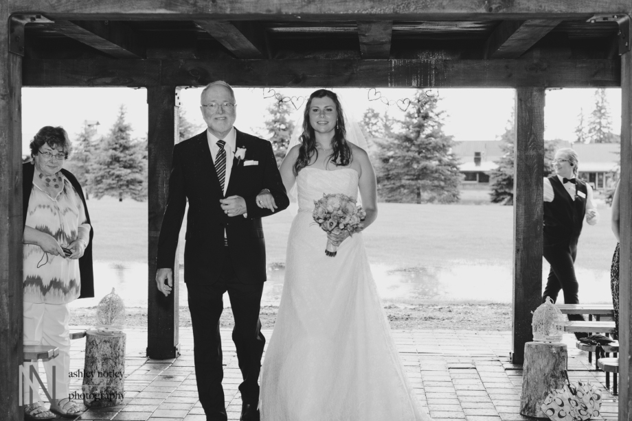 Bride and her father walking down the aisle at Beantown Ranch wedding