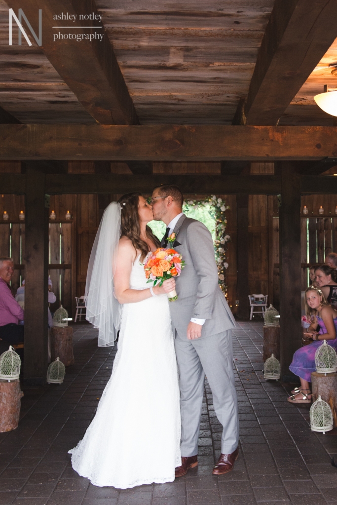 Bride and groom kissing at Beantown Ranch wedding
