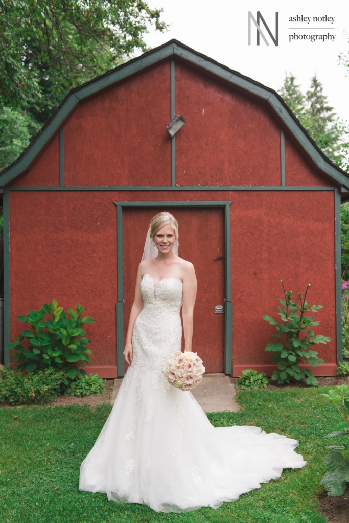 Bride in front of red shed