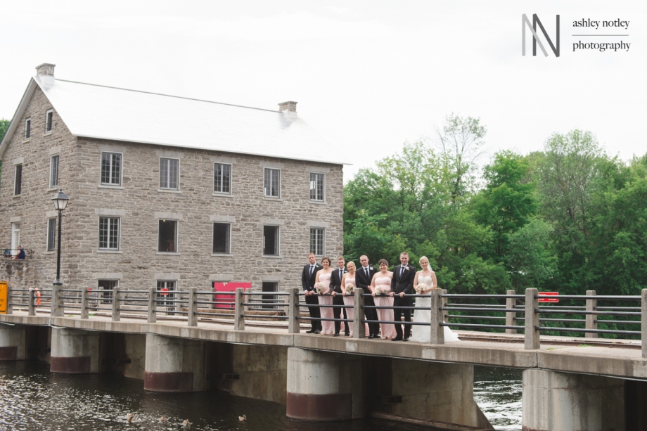 Wedding party in front of Watson's Mill on bridge