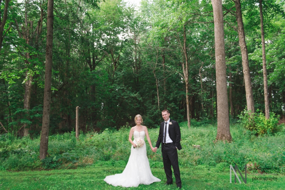 Bride and groom among the trees