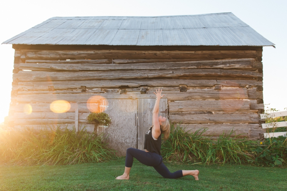 Low lunge in front of an old barn